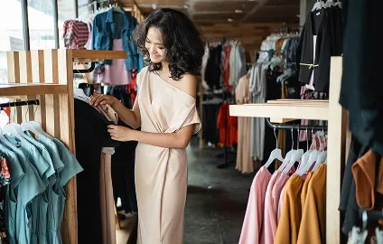A person in a dress in a clothing store