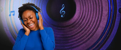 A person wearing headphones and smiling