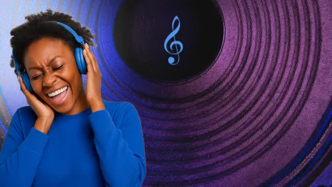 A person wearing headphones and smiling