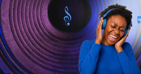 A person wearing headphones and smiling Og image