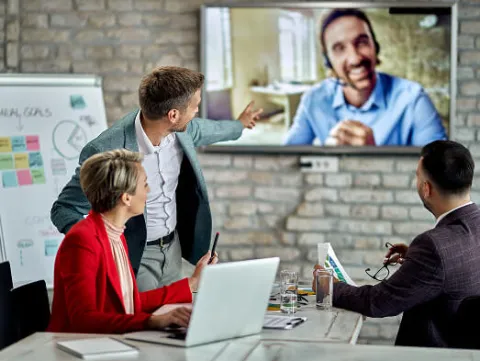A group of people in a workshop meeting